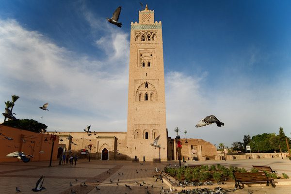 The Koutoubia Mosque of Marrakesh with Pigeons flying