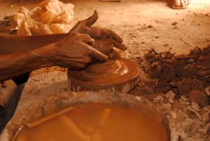 An Artisan Spins Pottery Clay in Tamegroute, Morocco near the Sahara Desert
