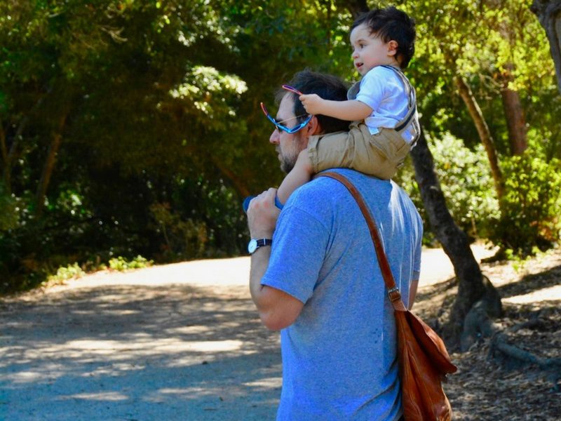 Father and son walking in a park taken for this Parent's Guide to Moroco
