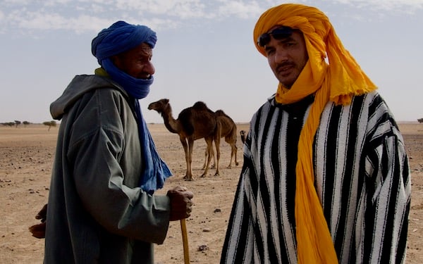 Nomadic men chatting around Erg Chigaga, perhaps about the price of camels